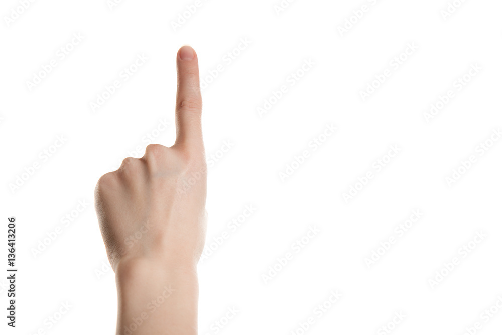 Hand girl shows the forefinger up isolation on a white background Hand girl shows the forefinger up isolation on a white background