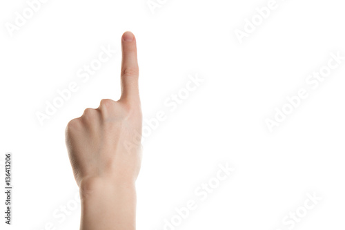 Hand girl shows the forefinger up isolation on a white background