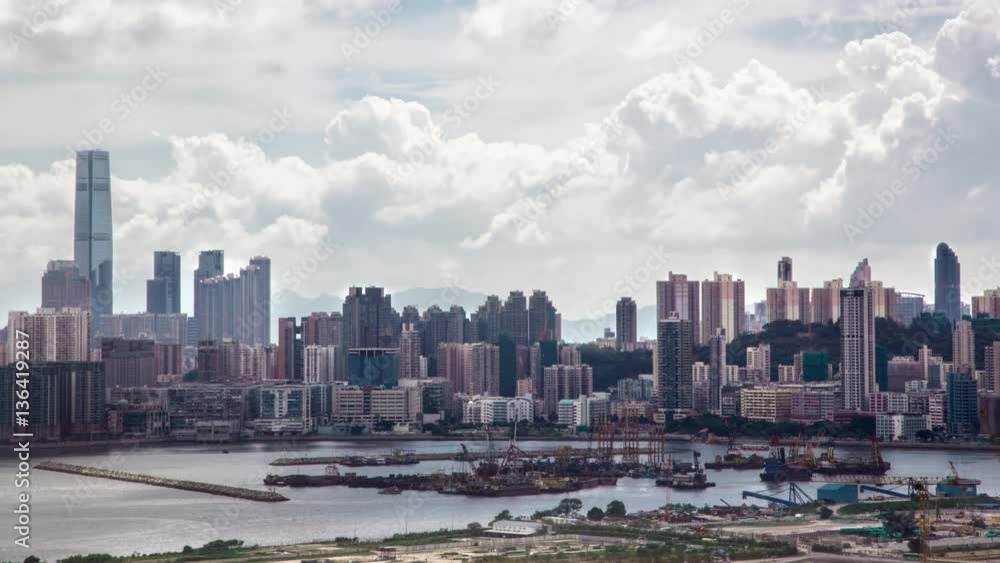 4k Timelapse Top View of Hong Kong Cityscape day whit clouds, skyline of the city near Kowloon Bay with ships and cars in freeway front the Harbour -Dan 4k Timelapse Top View of Hong Kong Cityscape day whit clouds, skyline of the city near Kowloon Bay with ships and cars in freeway front the Harbour -Dan