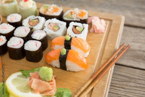 Set of assorted sushi served on wooden tray