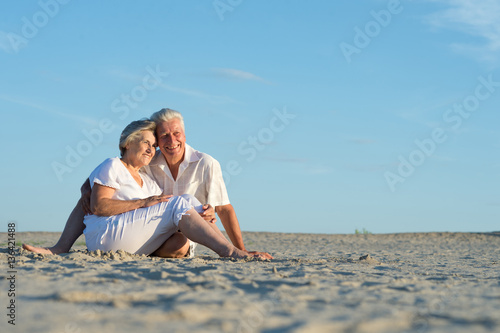 Happy olderly woman holding gift photo