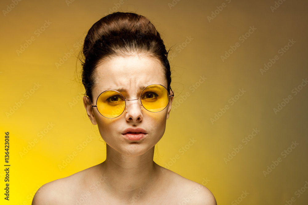 sad woman with glasses looks at the camera sad woman with glasses looks at the camera
