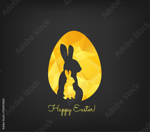 Happy Easter greeting card in low poly triangle style. Flat design polygon of golden easter egg and bunny isolated on black background