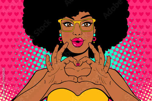 Wow pop art face. Sexy young african american woman with lips in form of kiss and afro hairstyle in glasses shows love heart sign. Vector colorful invitation poster in pop art retro comic style.