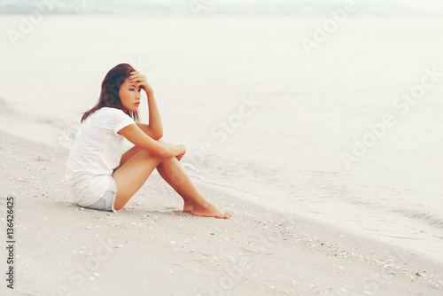 Lonely Asian young female on the beach