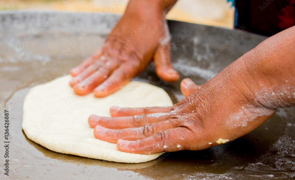 A woman preparing a cake in Tunisia A woman preparing a cake in Tunisia