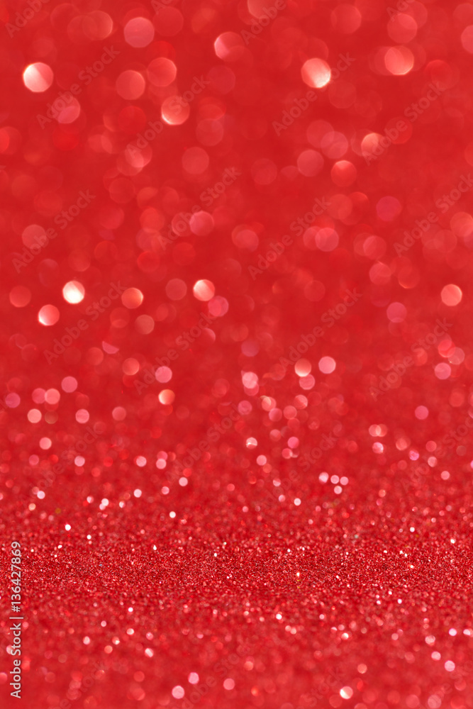 Decorative red glitter texture. Abstract background defocused. Bokeh. Selective focus. Decorative red glitter texture. Abstract background defocused. Bokeh. Selective focus.