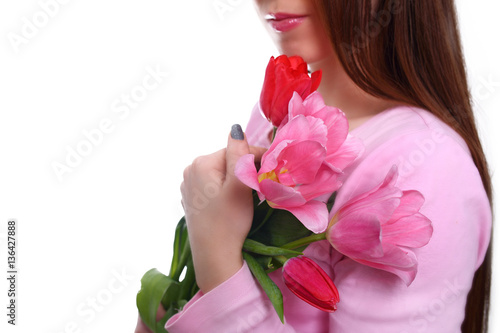 Bunch of tulips in woman's hands. 8 march. Isolated on white.