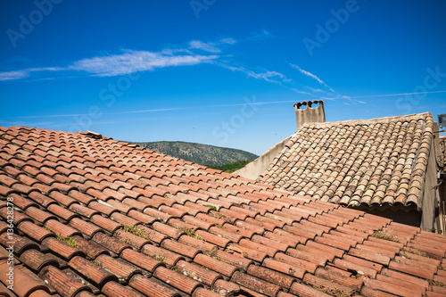 Mediterranean roofs with red tiles and blue sky in France © abasler