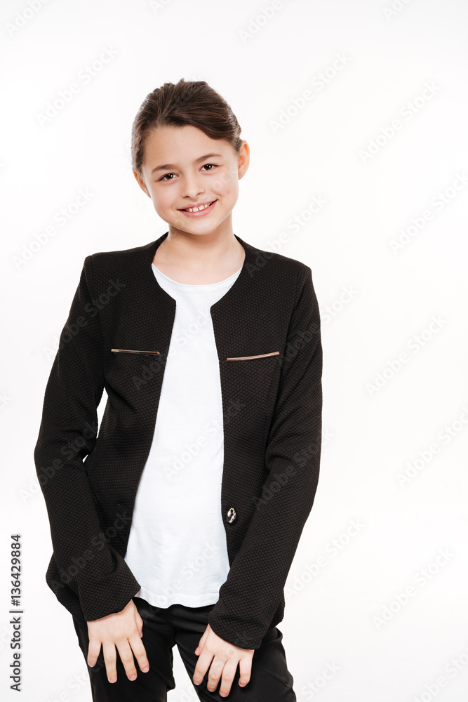 Cheerful young girl standing and posing