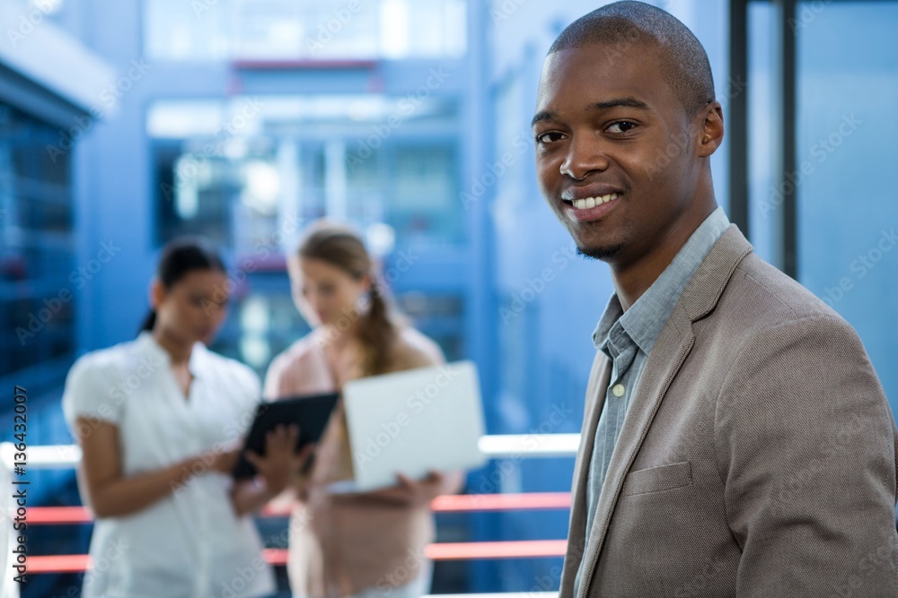 Business executive smiling in office Business executive smiling in office