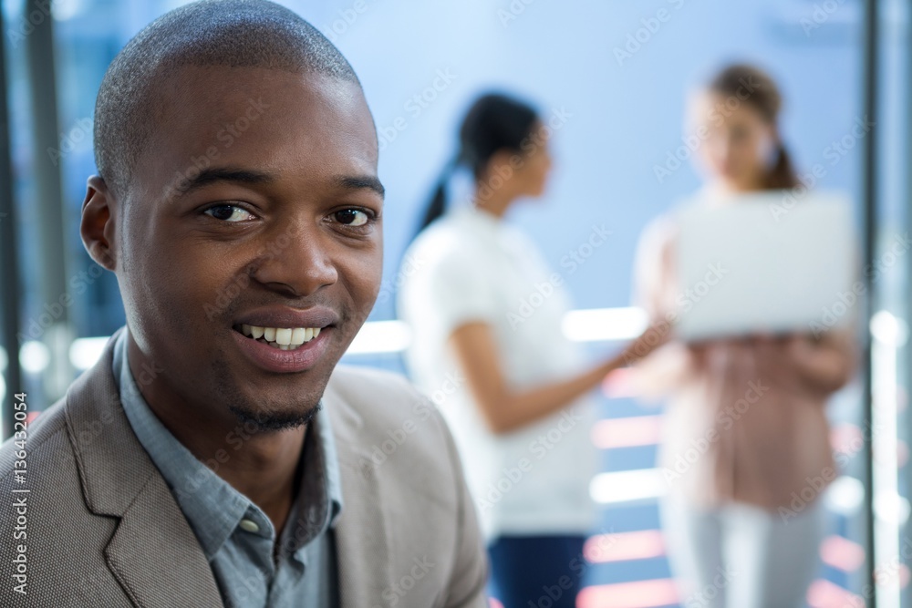 Business executive smiling in office Business executive smiling in office