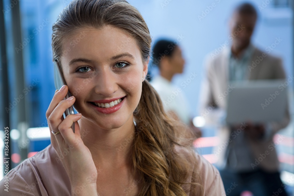 Beautiful woman talking on mobile phone Beautiful woman talking on mobile phone