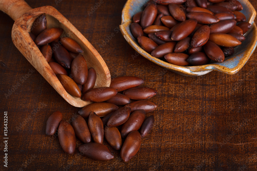 Baru almond on wooden background Baru almond on wooden background