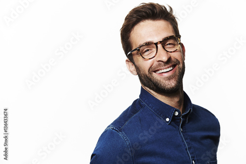 Laughing in blue shirt guy, portrait photo