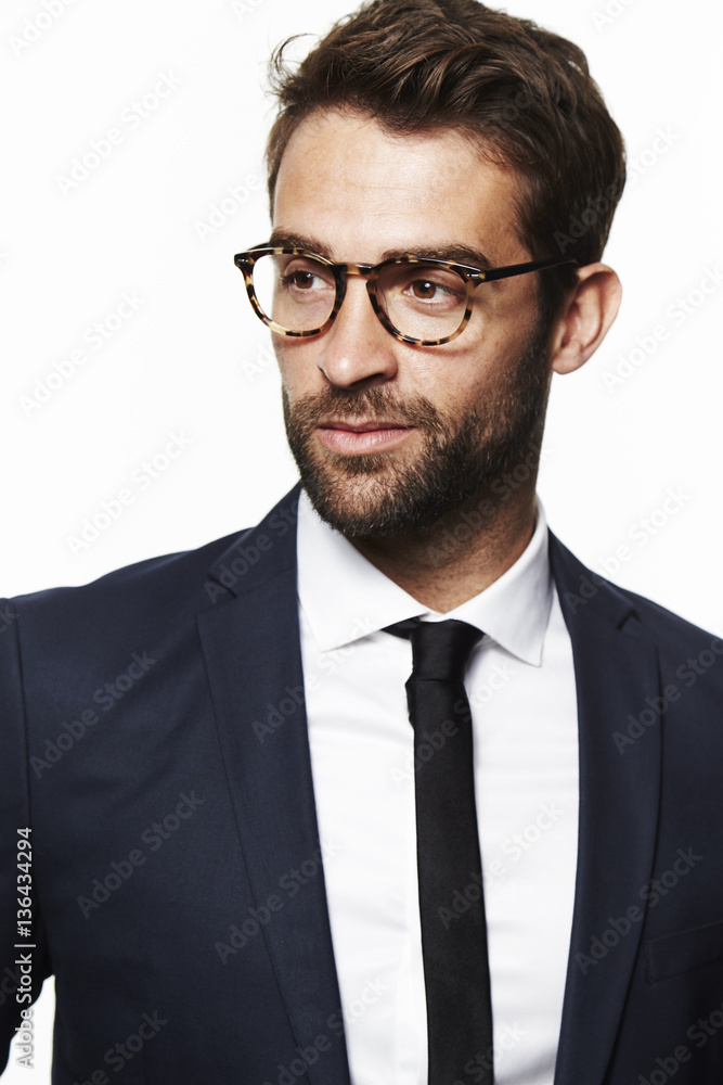Seriously suited man in glasses, studio Seriously suited man in glasses, studio