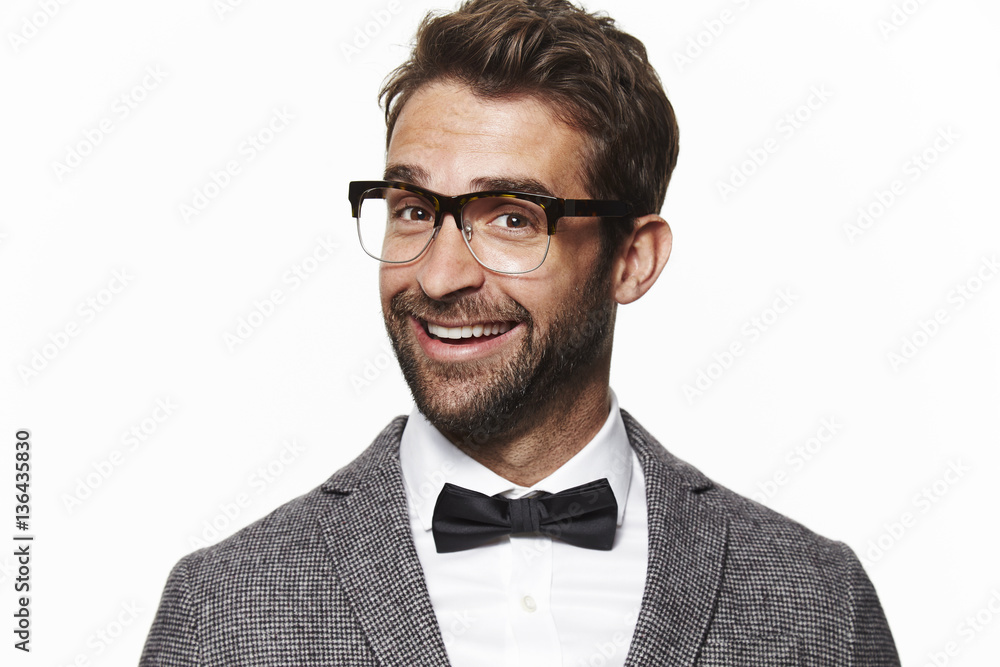 Smiling geek guy in bow tie, portrait Smiling geek guy in bow tie, portrait