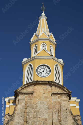 Historic Clock Tower (Torre del Reloj) above the main gateway into the historic walled city of Cateragena de Indias in Colombia photo