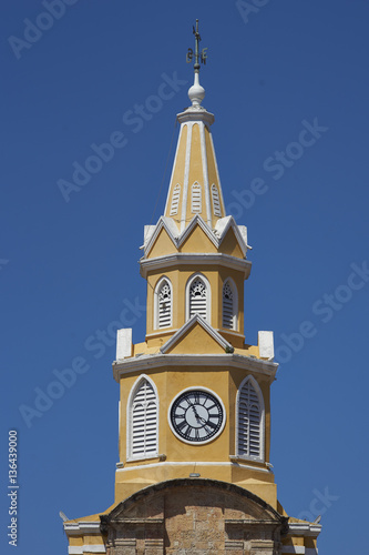 Historic Clock Tower (Torre del Reloj) above the main gateway into the historic walled city of Cateragena de Indias in Colombia photo