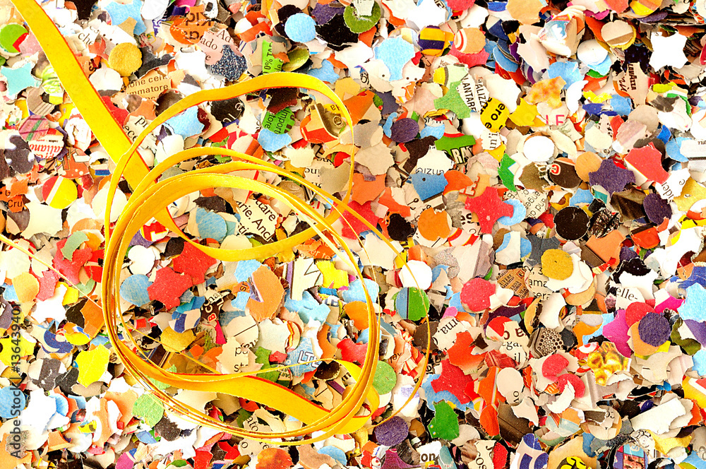Carnival background, colored confetti and streamers, from above