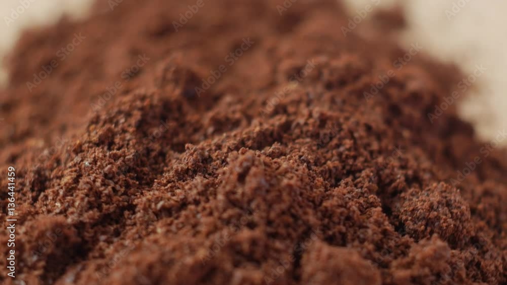 Fine ground coffee powder pile close-up shallow DOF. The slow rotation. Fine ground coffee powder pile close-up shallow DOF. The slow rotation.