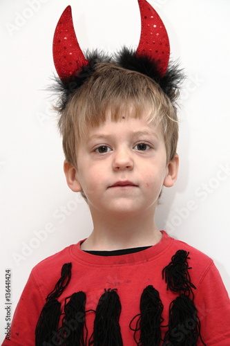 Small boy in the devils mask