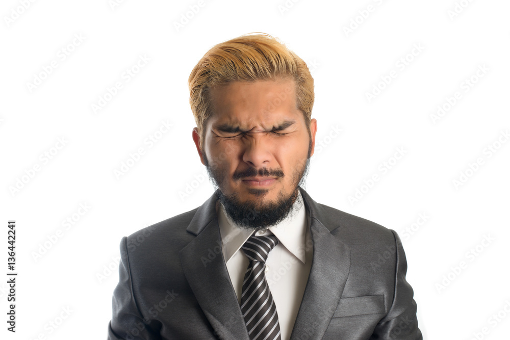 Handsome businessman suffering from headache over white. Handsome businessman suffering from headache over white.