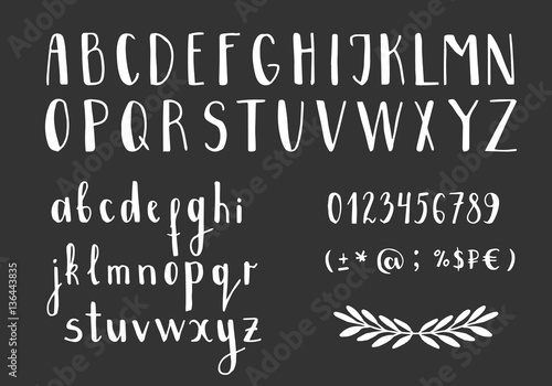 Set of handwritten latin letters. Vector script font. White alphabet isolated on black background.