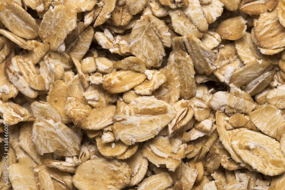 The texture of oatmeal. Oat flakes photo, oat background. oatmea The texture of oatmeal. Oat flakes photo, oat background. oatmea