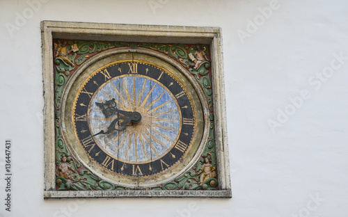 antique clock on a wall in the old town