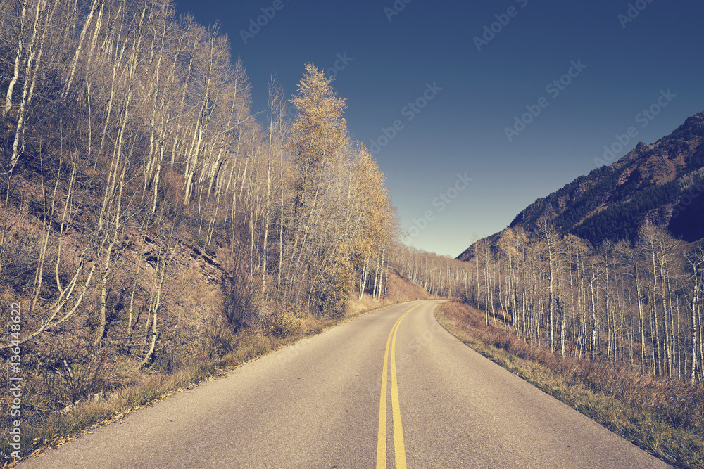 Retro color toned picture of a road, travel concept, USA