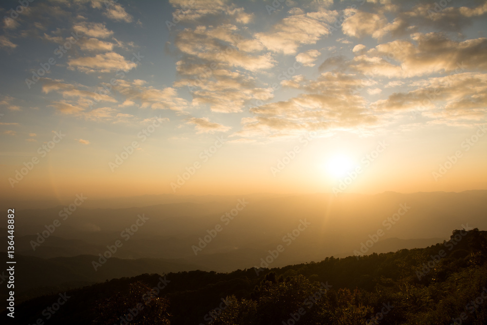 Sunset at the Mountain Hill,Beautiful sunlight, Golden lights background Sunset at the Mountain Hill,Beautiful sunlight, Golden lights background