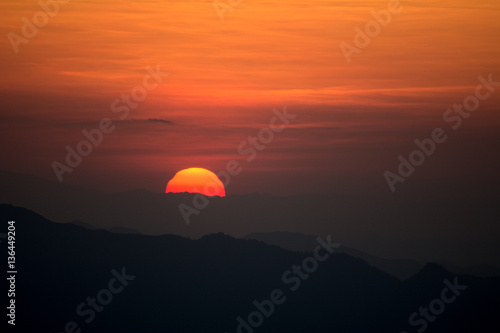 Sunset at the Mountain Hill,Beautiful sunlight, Orange lights background