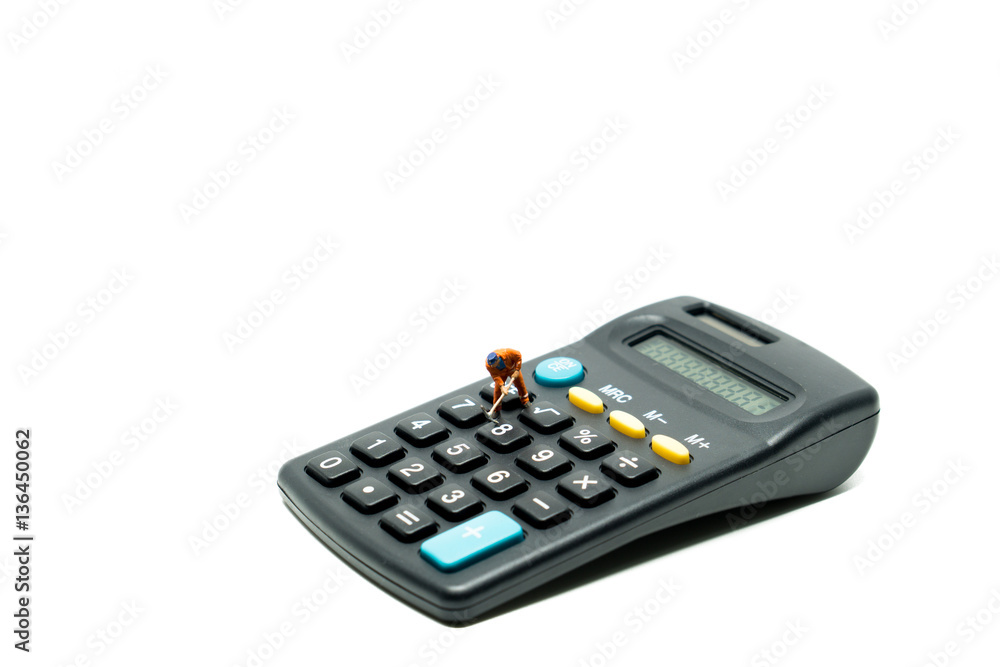 Miniature people worker and calculator Miniature people worker and calculator
