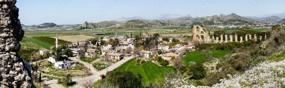 Panorama of Turkish village with ancient roman ruins