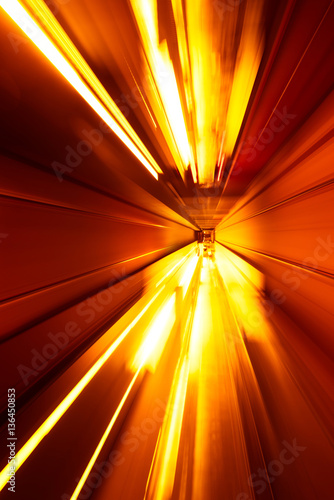 Fototapeta Naklejka Na Ścianę i Meble -  Futuristic background of speed motion blurred underground subway tunnel