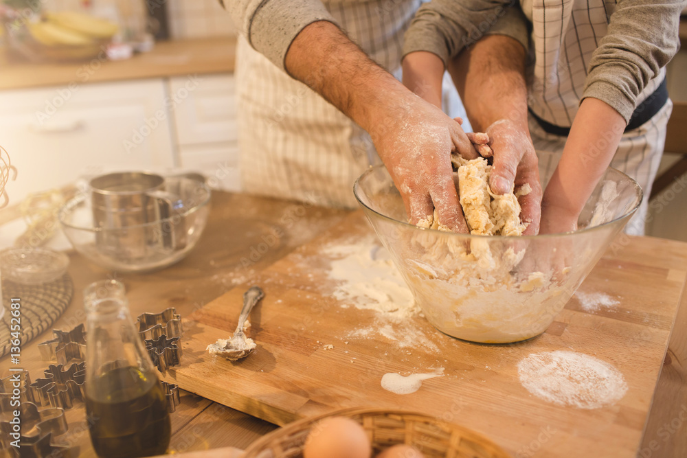 A father and his son cooking