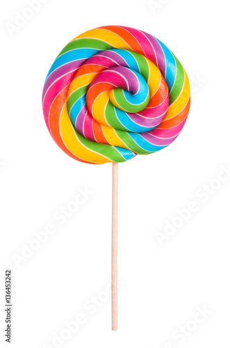 Colorful rainbow lollipop swirl on wooden stick isolated on white background