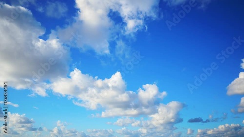 Timelapse shot of beautiful clouds rolling over sky. Aerial footage of cloudscape against blue sky. Idyllic view of nature on sunny day. 4K resolution.
 photo