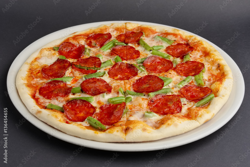 pizza pepperoni on black table
