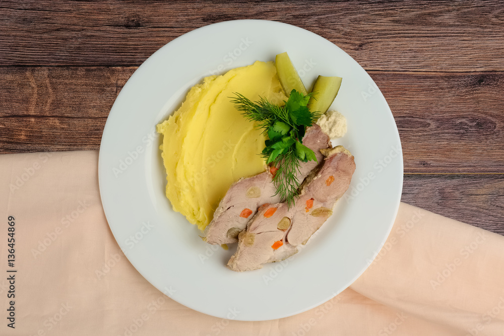 Top view of cold boiled pork with potato puree and pickled cucum Top view of cold boiled pork with potato puree and pickled cucum