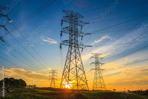 Canvastavla A high voltage of transmission tower in the morning sunrise with the beauty of a