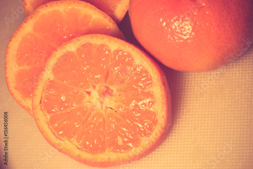 Ripe orange and slices with vintage retro filter