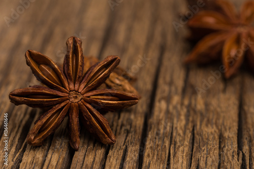 Star anise on old wooden table.