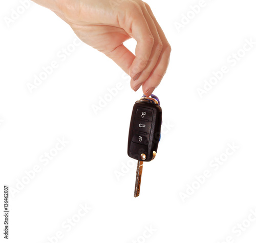 Car key in hand isolated on white background