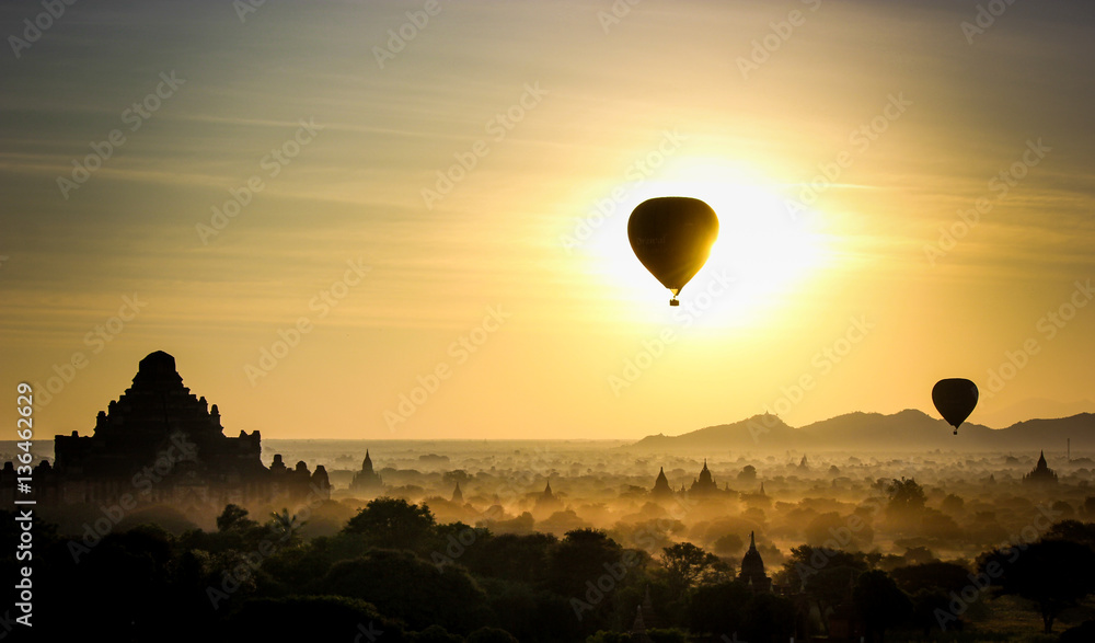 Sunrise with hot air balloons hovering over pagodas in bagan, Myanmar. Sunrise with hot air balloons hovering over pagodas in bagan, Myanmar.