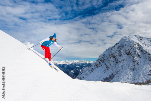 Girl in off-piste skiing
