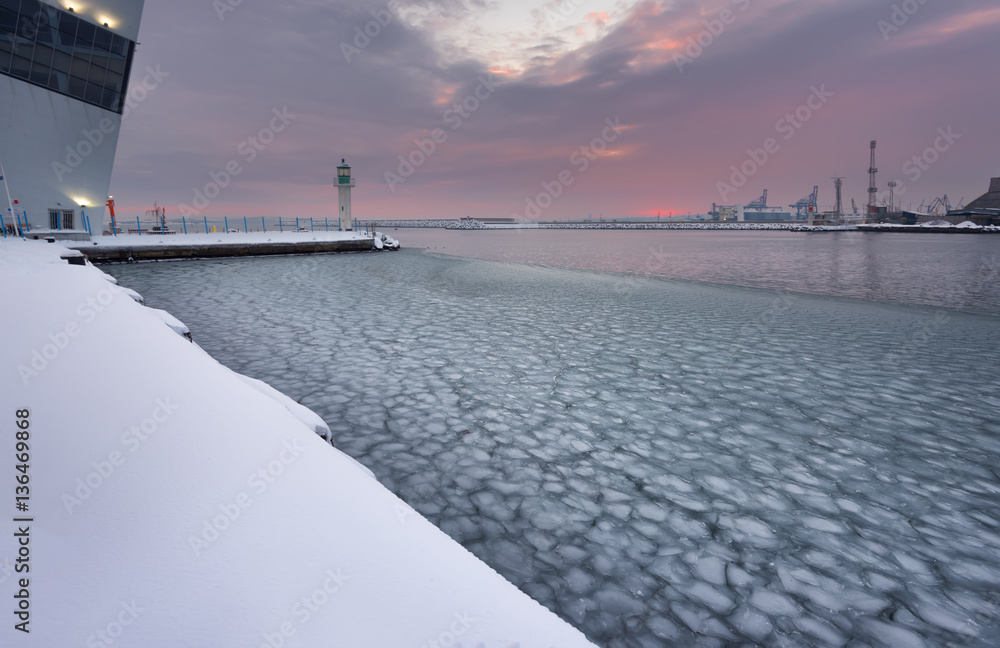 Winter fire sunset and frozen sea at the Marine station, Burgas, Bulgaria