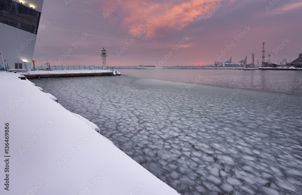 Winter fire sunset and frozen sea at the Marine station, Burgas, Bulgaria