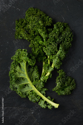 Kale Leaves on a Dark Gray Stone Background